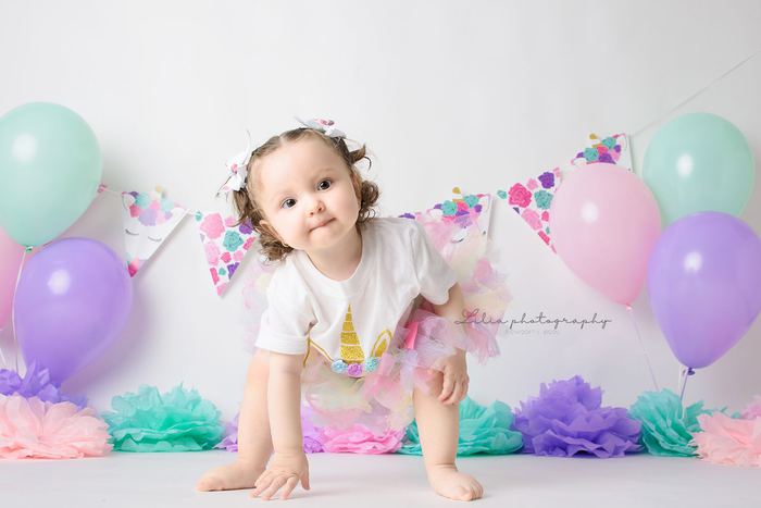 First birthday cake smash portrait by Lilia Photography